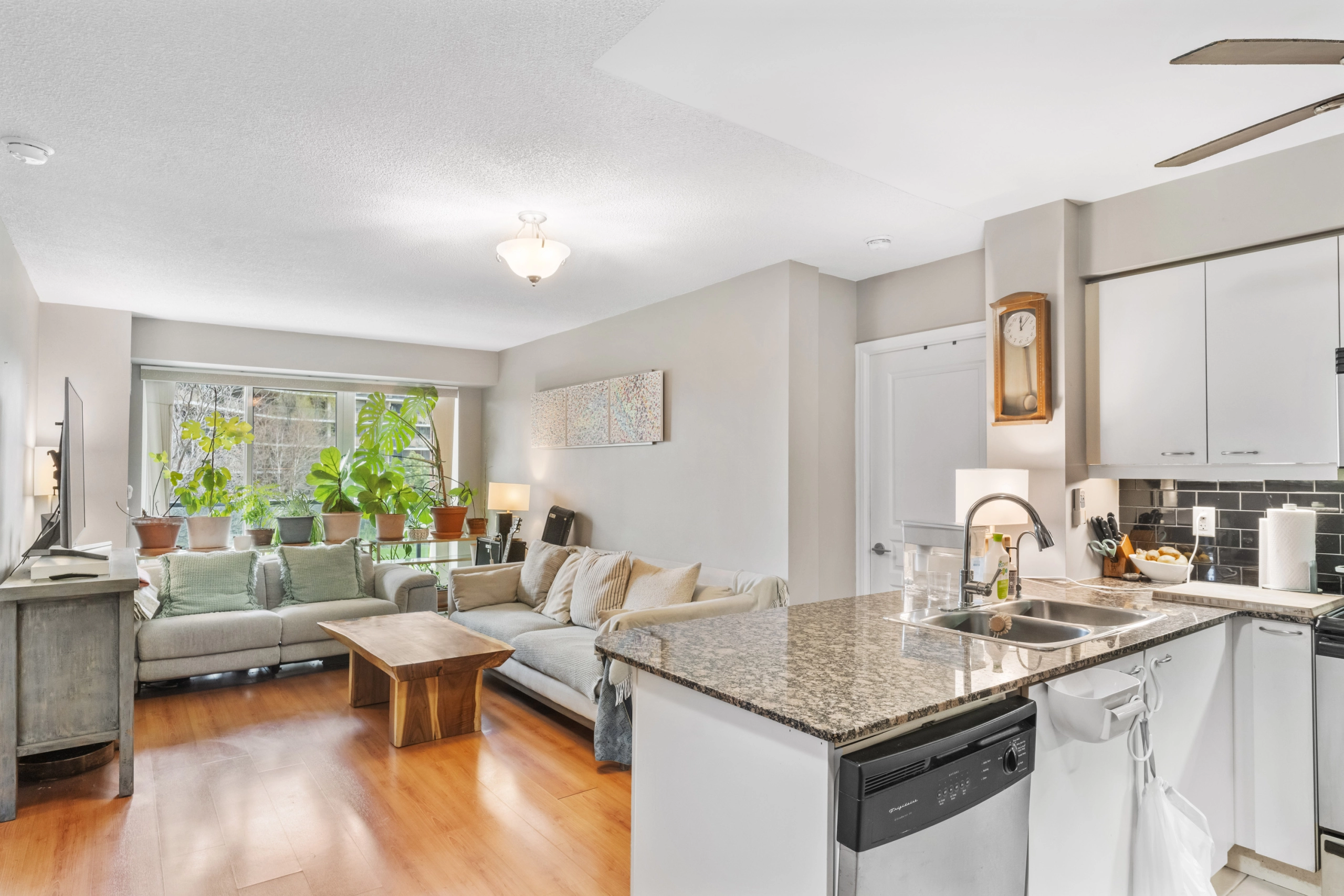Kitchen looking into the living room of 1403 Royal York Road unit 306 located in Etobicoke which is listed by Etobicoke real estate agent Marco Pedri.