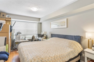 Primary bedroom of 1403 Royal York Road unit 306 located in Etobicoke which is listed by Etobicoke real estate agent Marco Pedri.